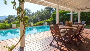 1136x794_Making_changes_to_your_Spanish_home_this_summer.jpg Backyard deck and swimming pool