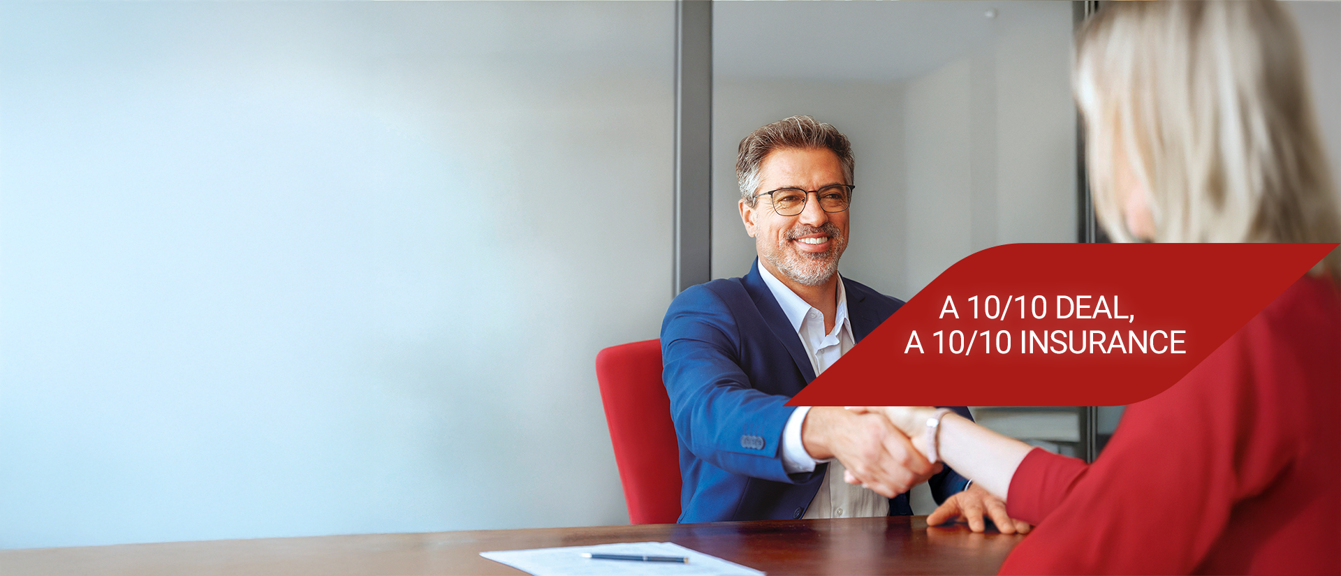 A 10/10 deal, a 10/10 insurance Two people shaking hands