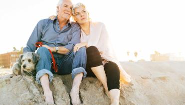 An elderly couple on the beach