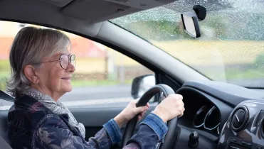 Old woman driving a car